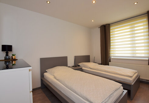 Schlafzimmer 1 mit getrennten Betten